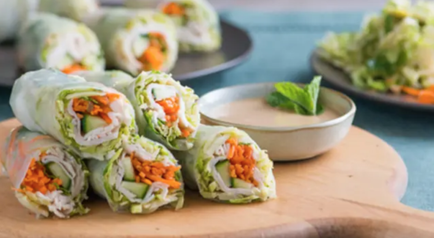 Spring rolls on a wooden cutting board Spring rolls on a wooden cutting board