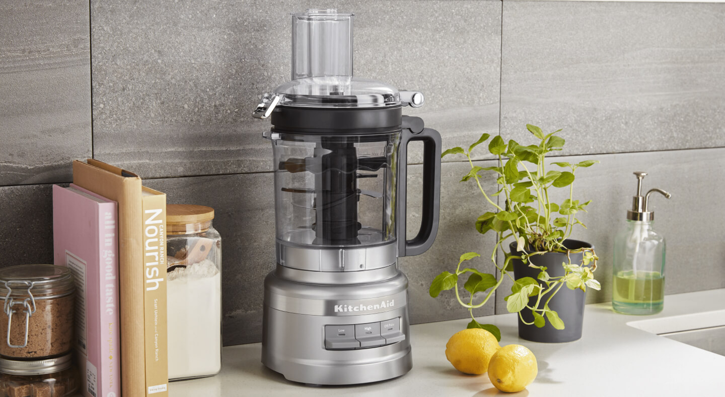 KitchenAid® food processor on a modern kitchen counter. KitchenAid® food processor on a modern kitchen counter.