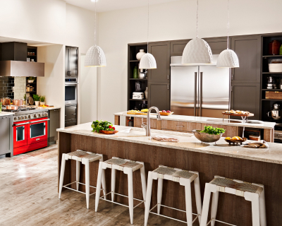 Greens and other salad ingredients on center island of kitchen