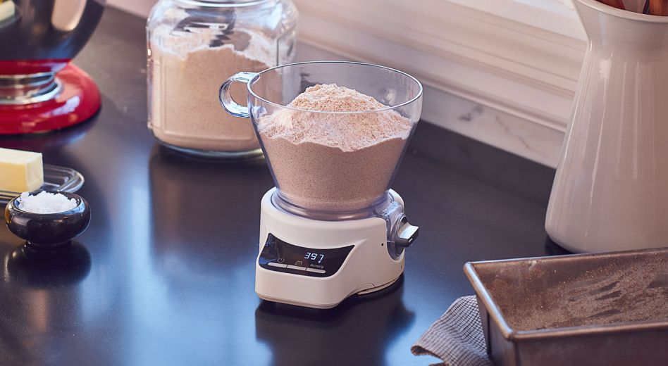 Flour in a measuring cup on a scale  Flour in a measuring cup on a scale