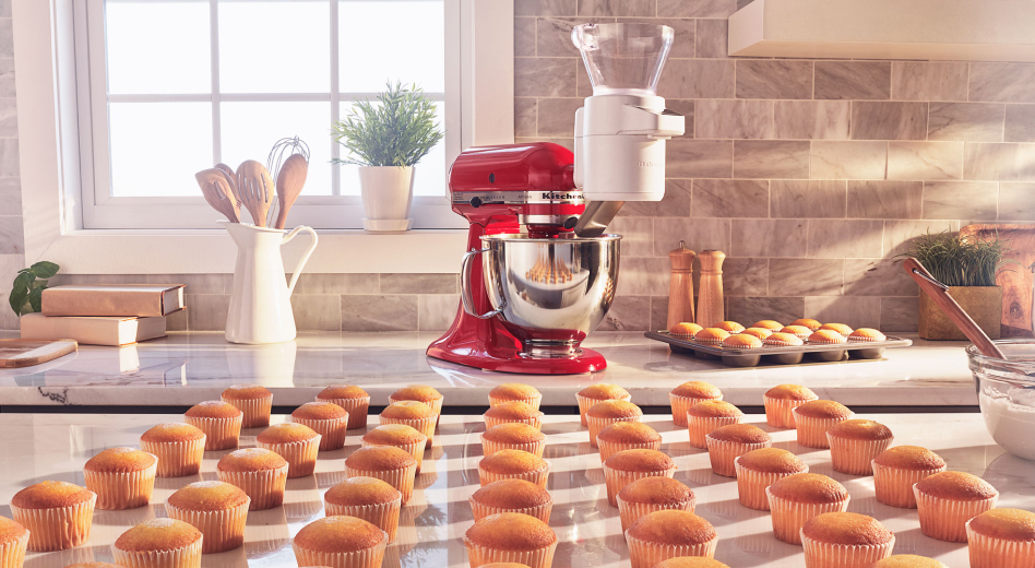 Rows of cupcakes in front of a KitchenAid® stand mixer  Rows of cupcakes in front of a KitchenAid® stand mixer