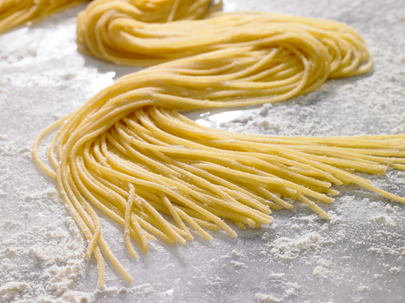  Nest of spaghetti laying in flour