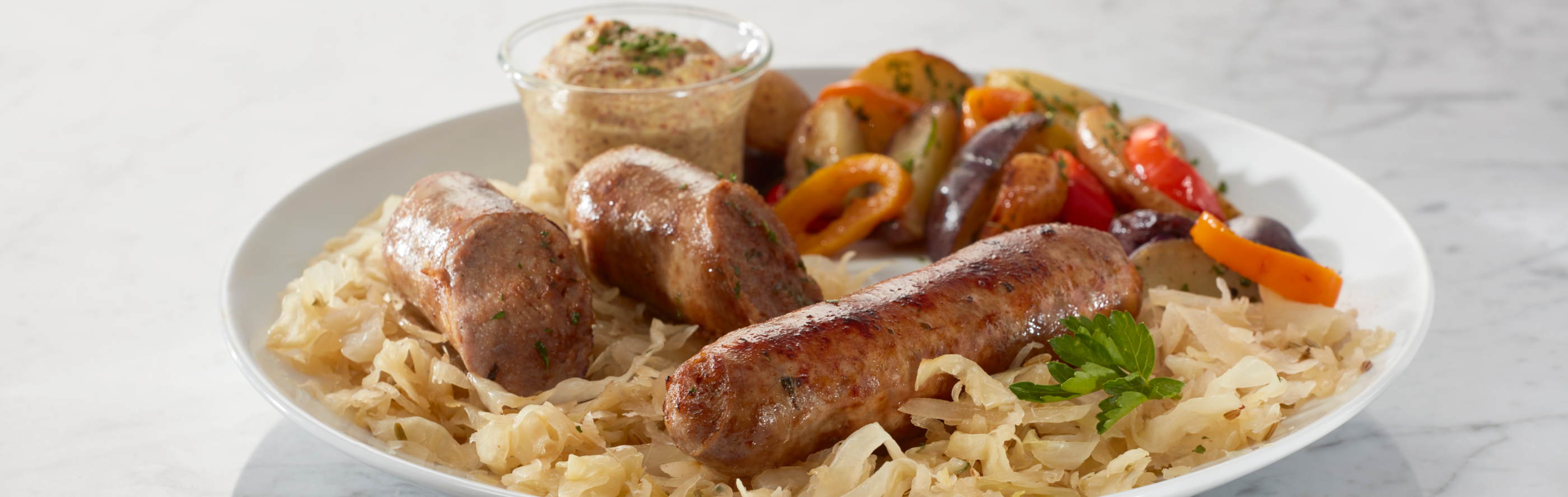 Sausages on a plate of pasta