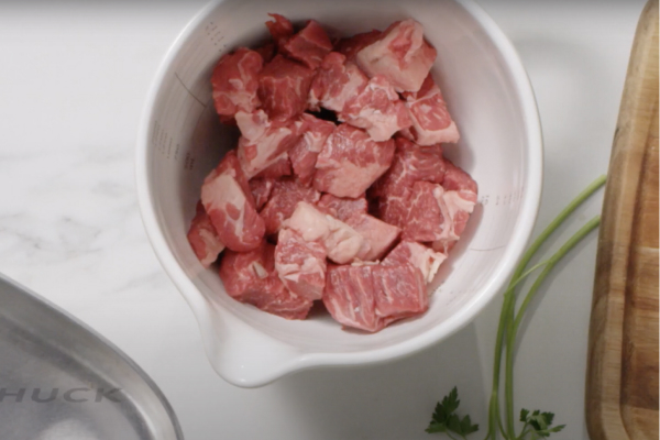 Bowl with chilled cubed meat