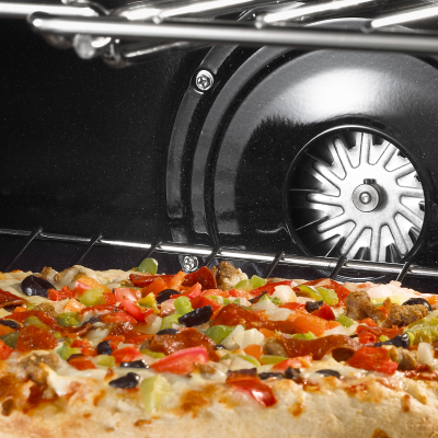 Interior of oven with baking pizza