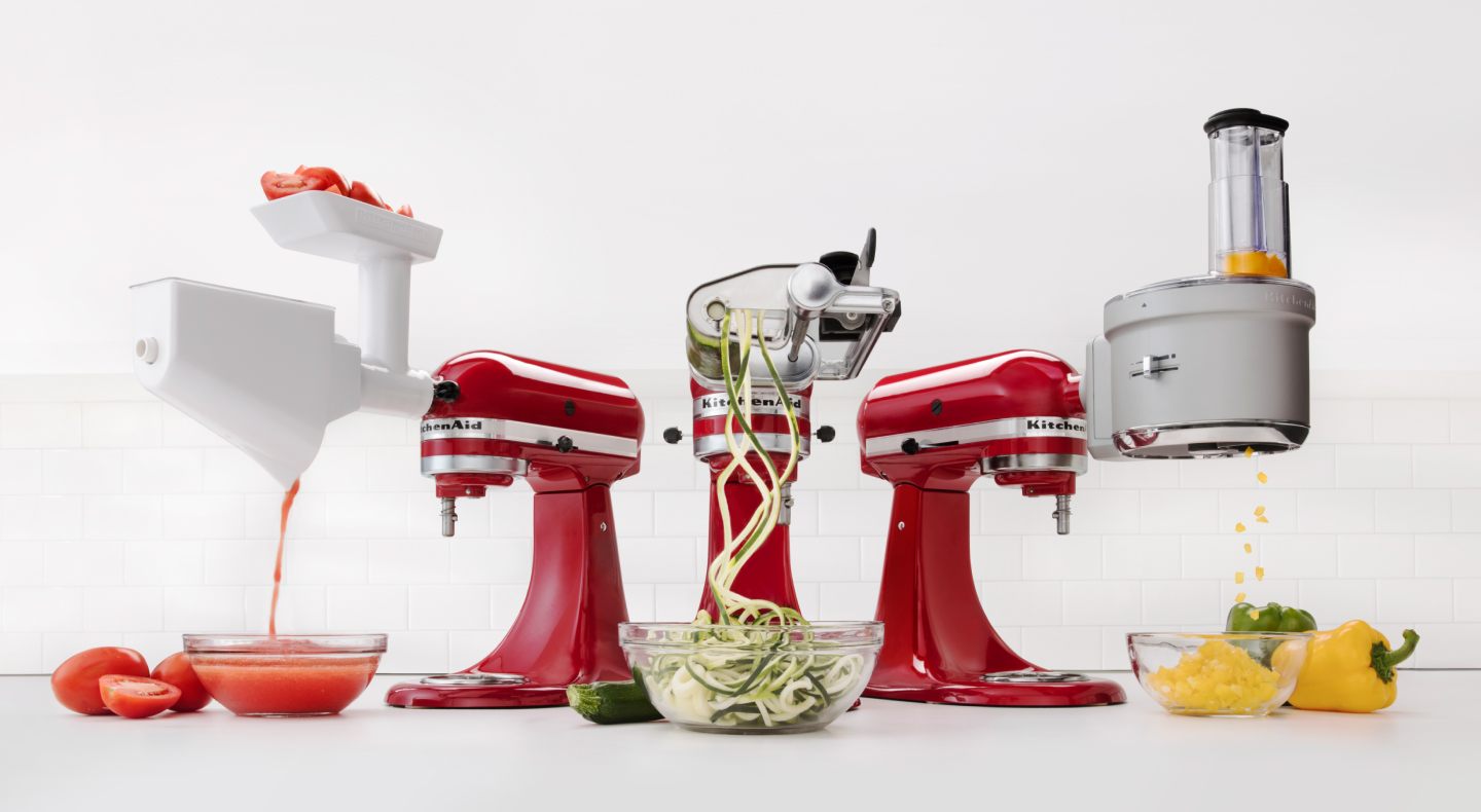 Lineup of KitchenAid® accessories attached to red KitchenAid® stand mixers Lineup of KitchenAid® accessories attached to red KitchenAid® stand mixers