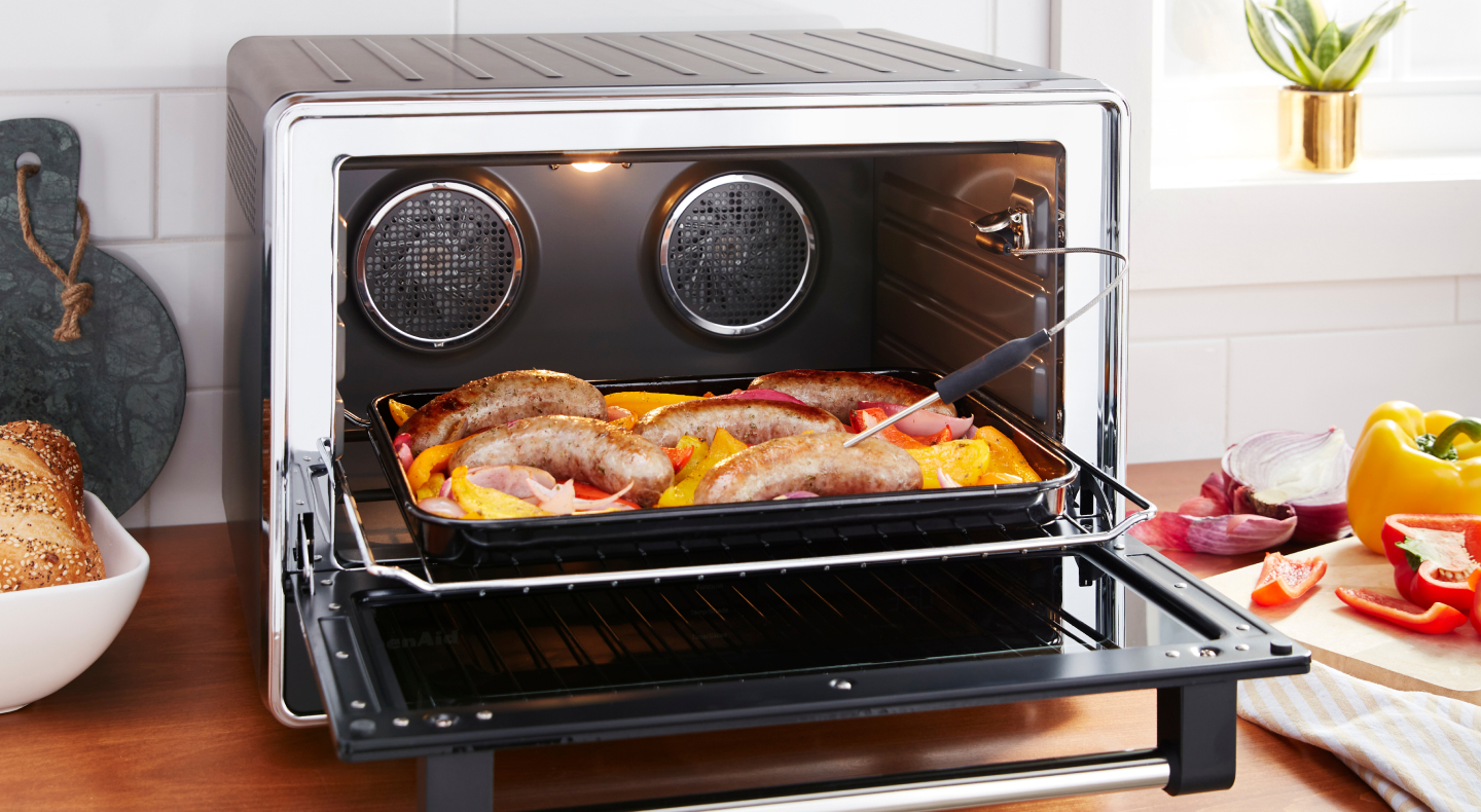 Same as Image Alt Text Meat and produce on air fryer tray with door open.