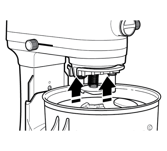 Drive assembly correctly positioned on stand mixer with arrows indicating push