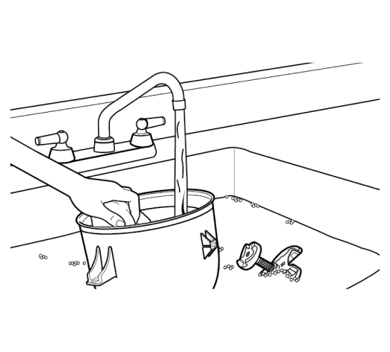 Hand washing ice cream maker parts in sink