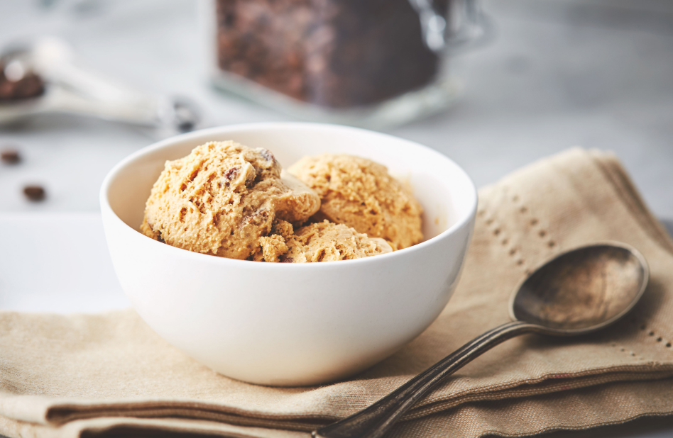 Homemade espresso ice cream in white bowl with napkin and spoon Homemade espresso ice cream in white bowl with napkin and spoon
