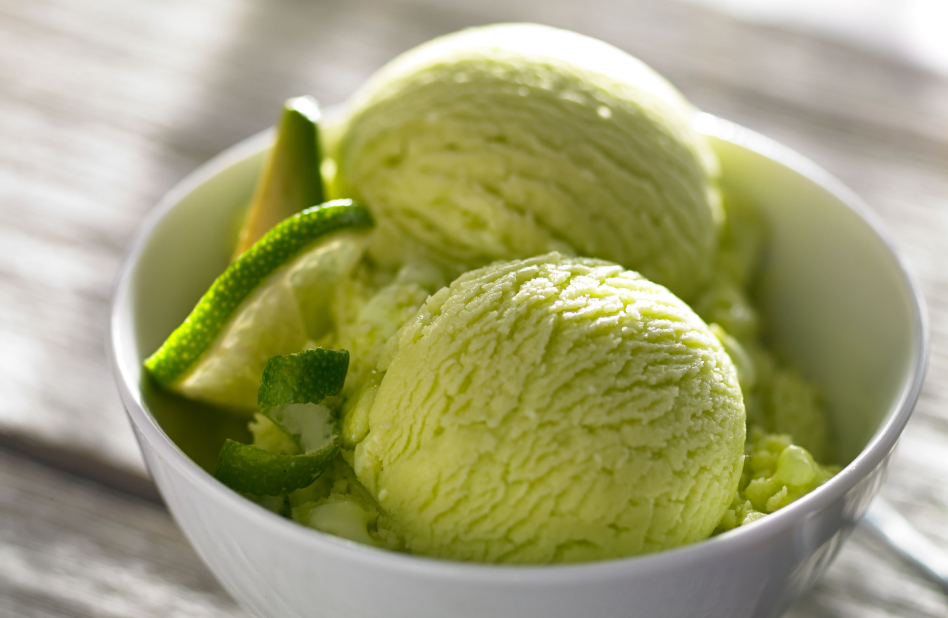 Bowl of homemade green ice cream with lime slices  Bowl of homemade green ice cream with lime slices