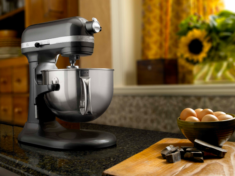 KitchenAid® stand mixer next to a bowl of fresh eggs.