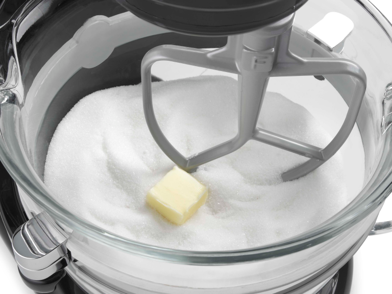 A closeup of a KitchenAid® stand mixer flat beater accessory.