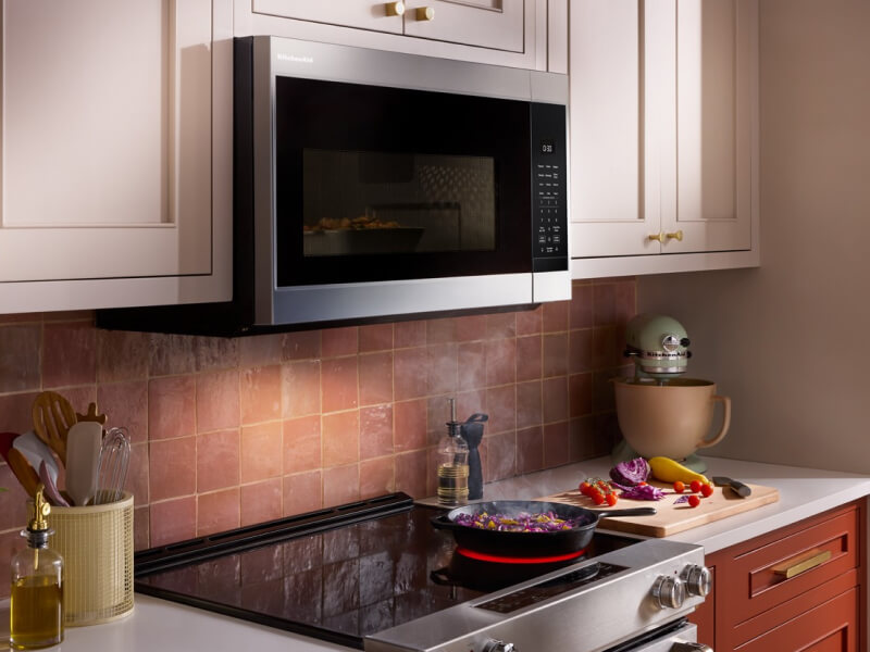 KitchenAid® over-the-range microwave above brick-colored backsplash KitchenAid® over-the-range microwave above brick-colored backsplash