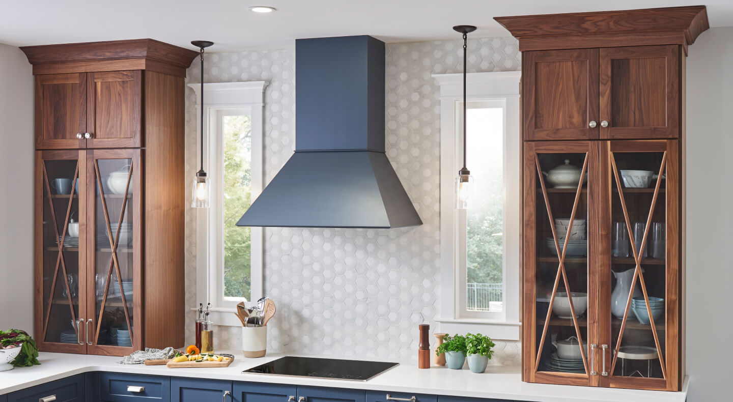 Wall-mount range hood over an electric cooktop Wall-mount range hood over an electric cooktop