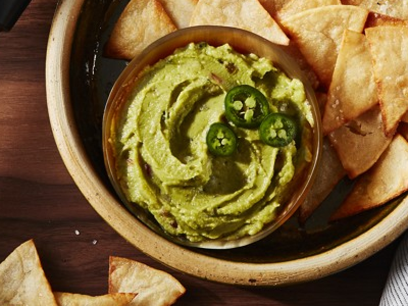 Guacamole in bowl with chips