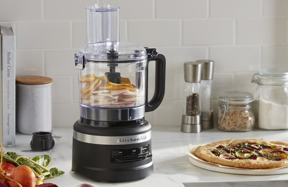 KitchenAid® food chopper next to pizza