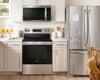 KitchenAid® oven, microwave and refrigerator appliance suite in a modern kitchen