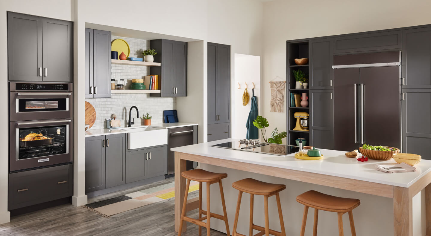 KitchenAid® refrigerator, wall oven and dishwasher appliance suite in a modern kitchen