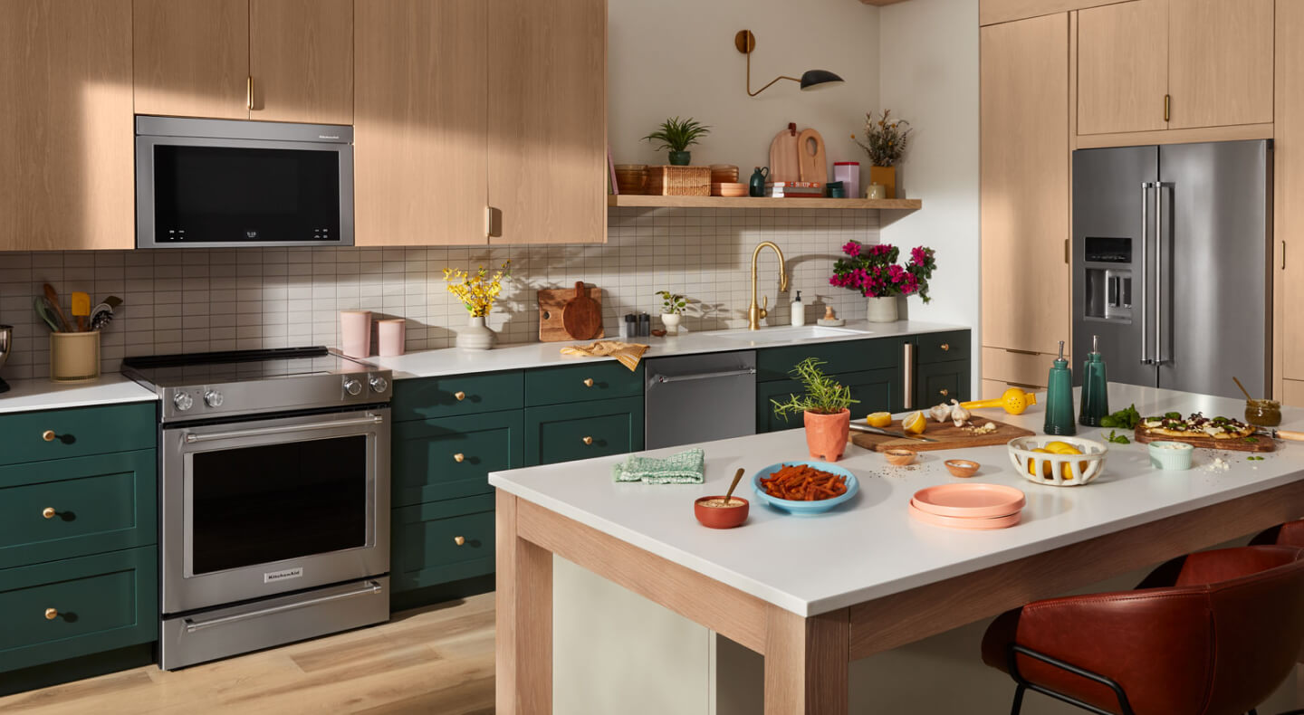 KitchenAid® oven, microwave, dishwasher and refrigerator appliance suite in a modern kitchen