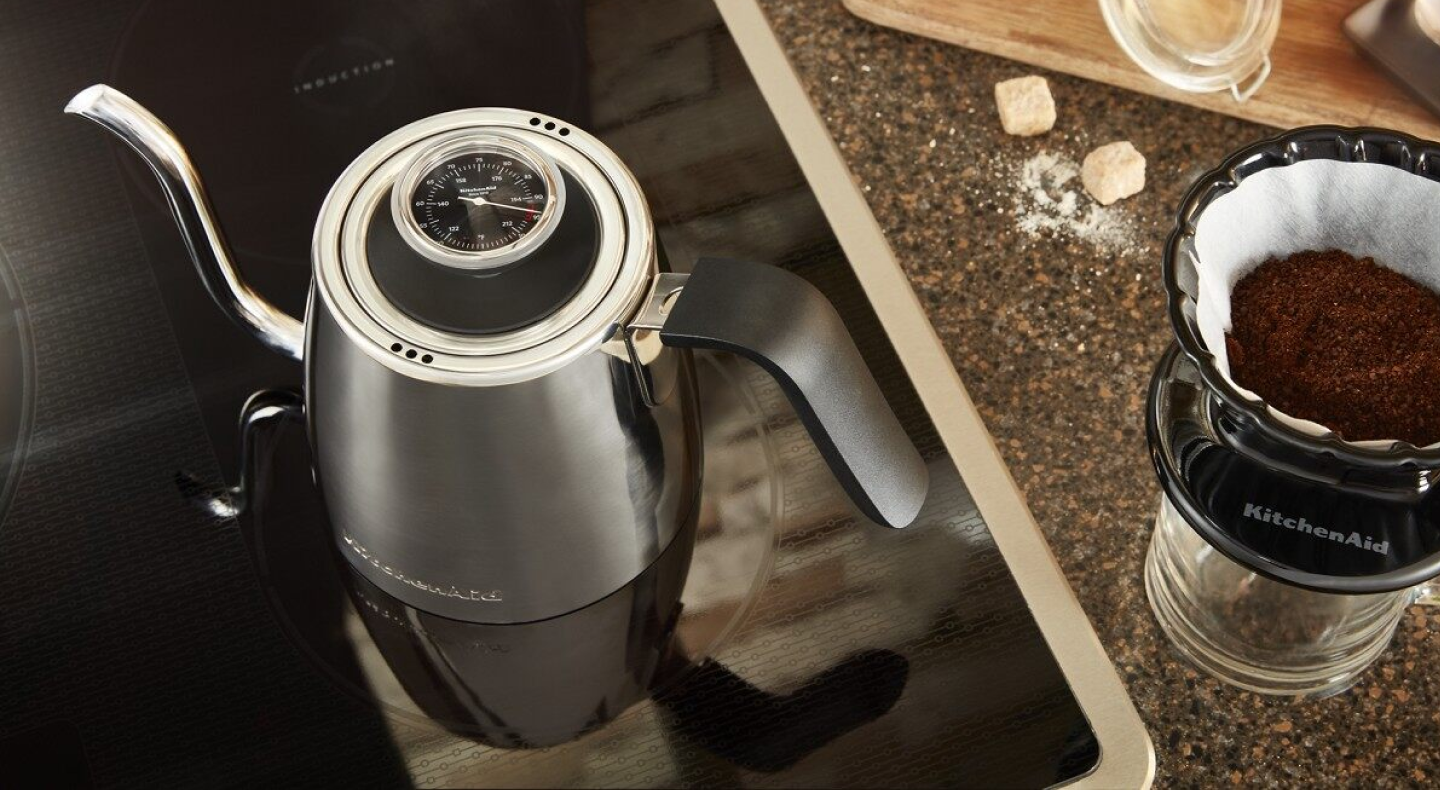 Gooseneck kettle next to pour over coffee maker Gooseneck kettle next to pour over coffee maker