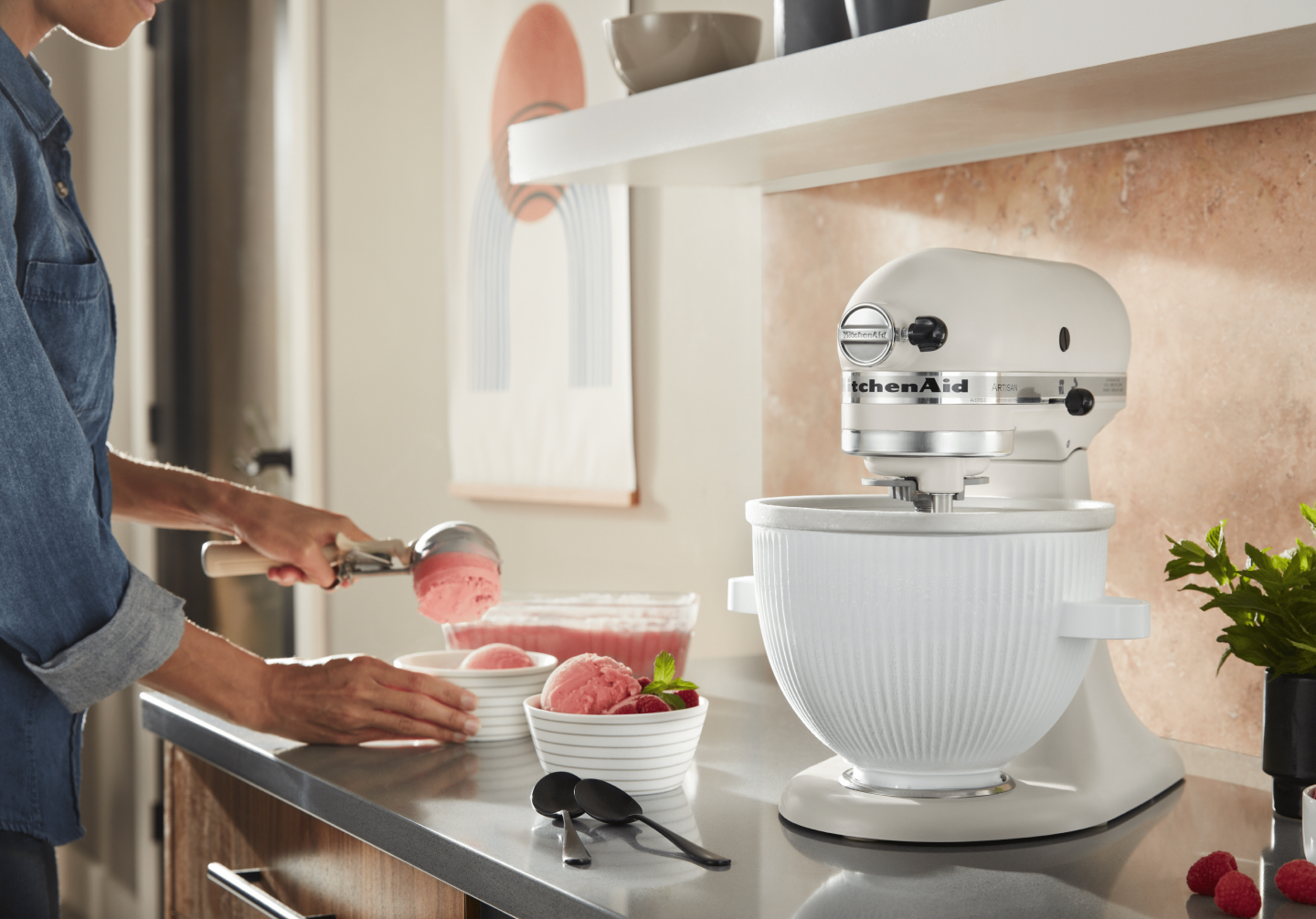Woman scooping ice cream into bowls next to stand mixer with KitchenAid® Ice Cream Maker Attachment Woman scooping ice cream into bowls next to stand mixer with KitchenAid® Ice Cream Maker Attachment