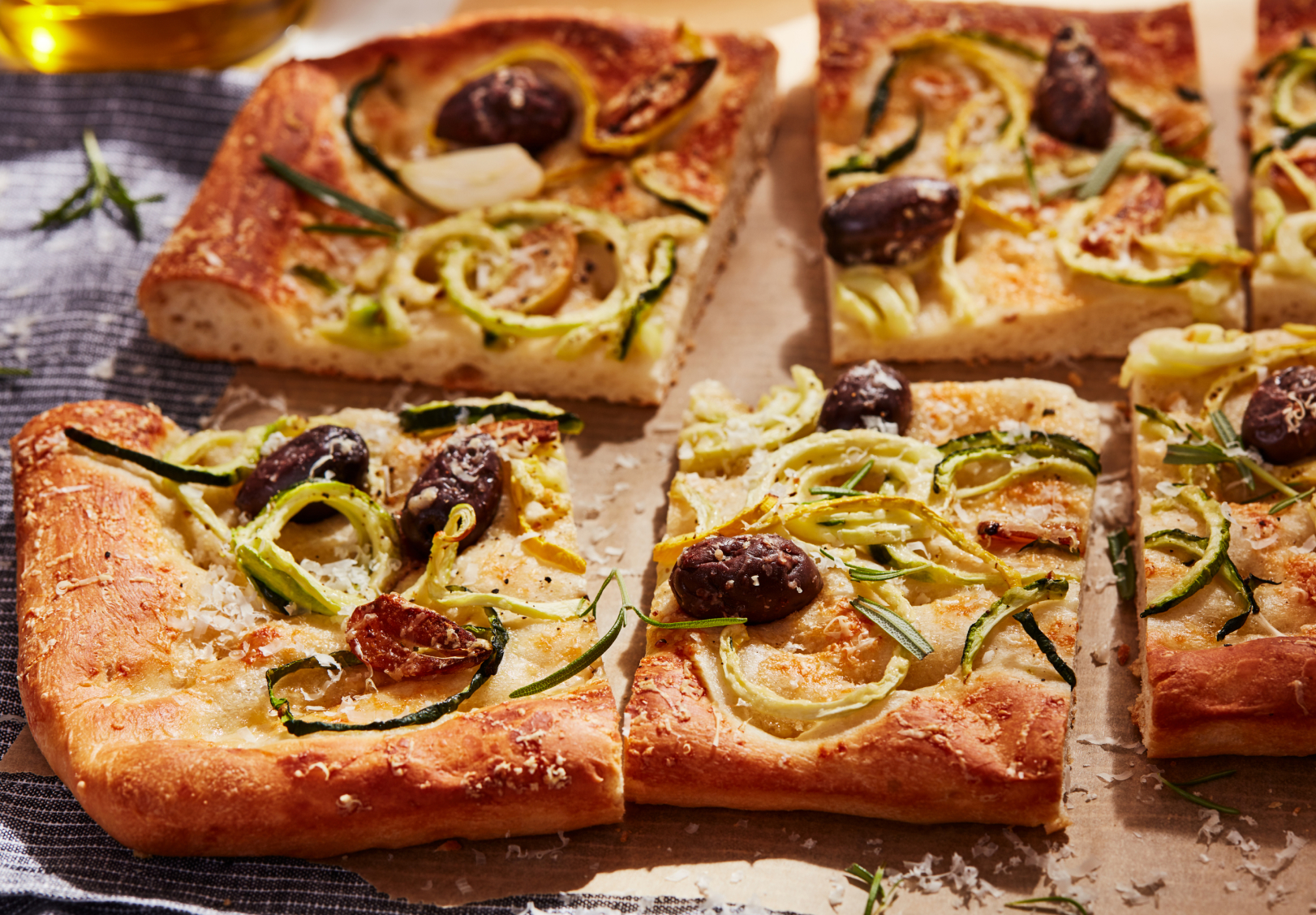 Thin crust, artisan pizza cut into slices Thin crust, artisan pizza cut into slices