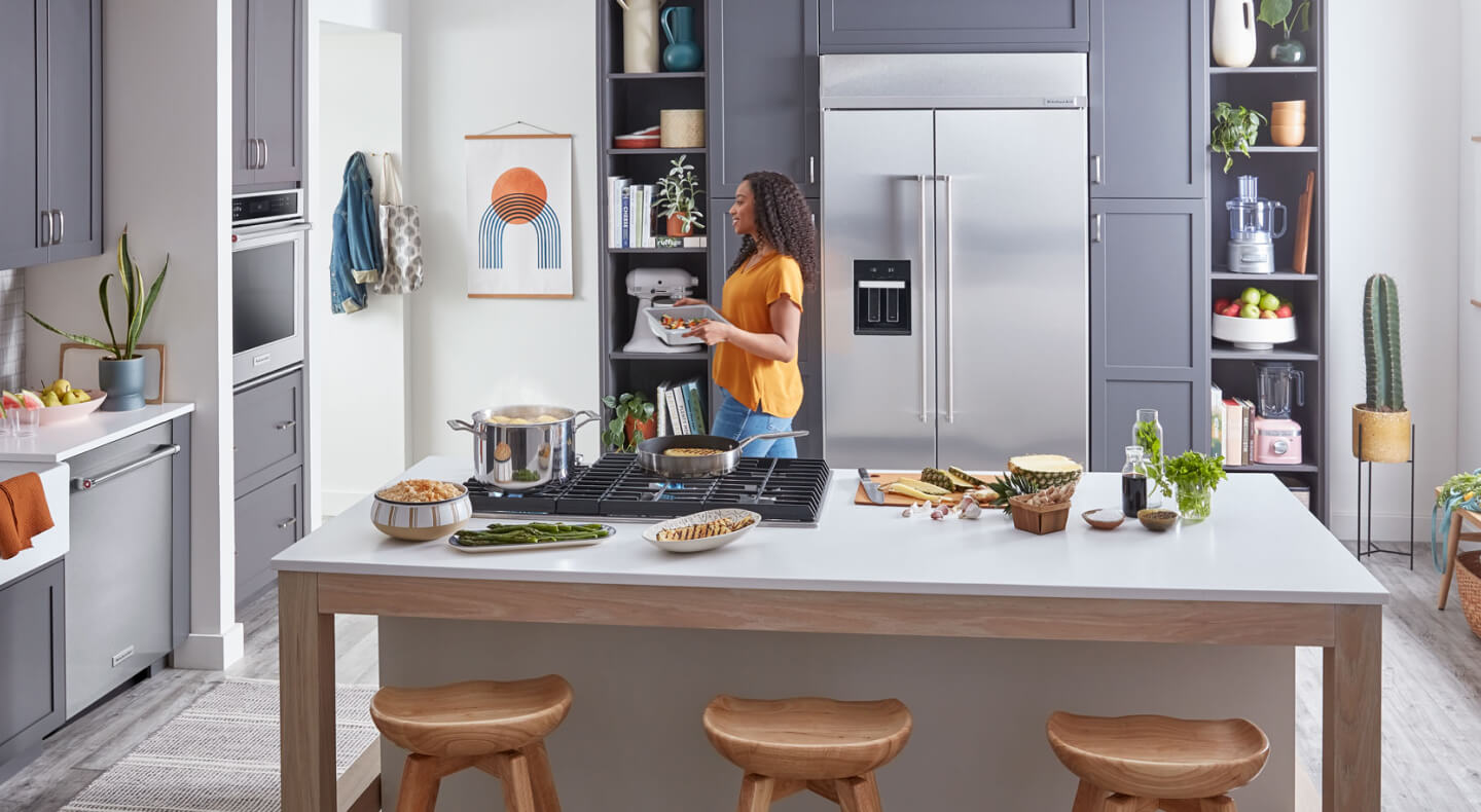 A KitchenAid® large capacity refrigerator tucked into cabinet space A KitchenAid® large capacity refrigerator tucked into cabinet space