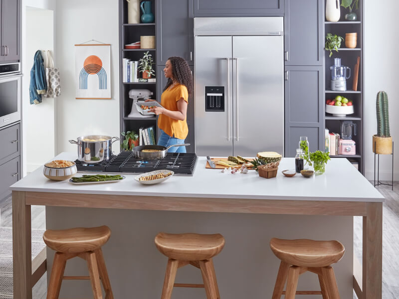 A KitchenAid® large capacity refrigerator tucked into cabinet space A KitchenAid® large capacity refrigerator tucked into cabinet space