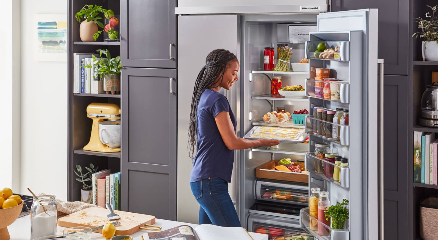 Retrieving a tray of food from a large capacity refrigerator Retrieving a tray of food from a large capacity refrigerator