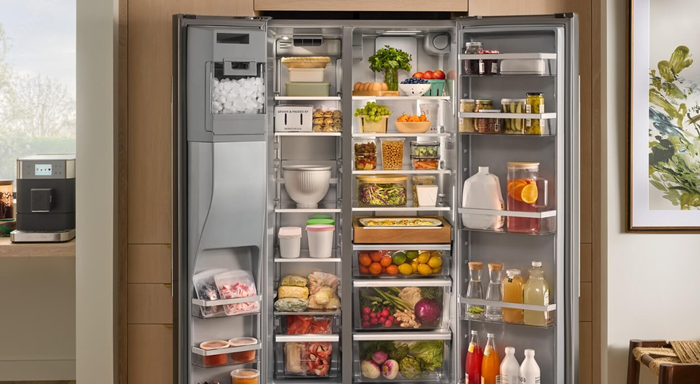 Open KitchenAid® side-by-side refrigerator fully stocked with food
