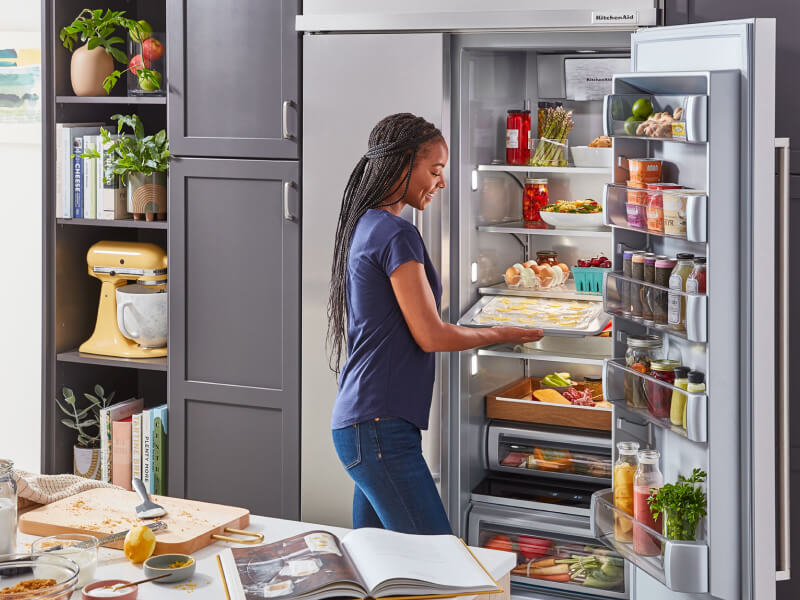 Retrieving a tray of food from a large capacity refrigerator Retrieving a tray of food from a large capacity refrigerator