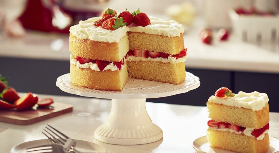 Homemade strawberry shortcake on cake stand  Homemade strawberry shortcake on cake stand