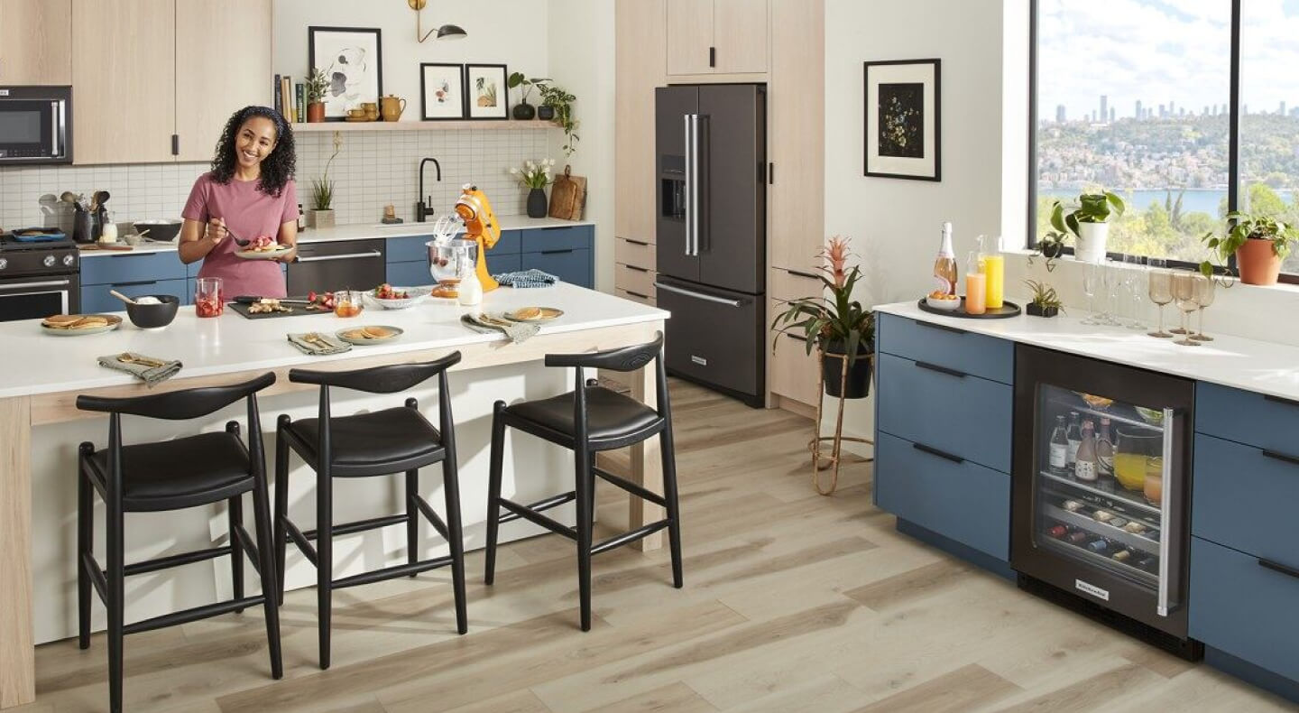 Person eating inside a contemporary kitchen