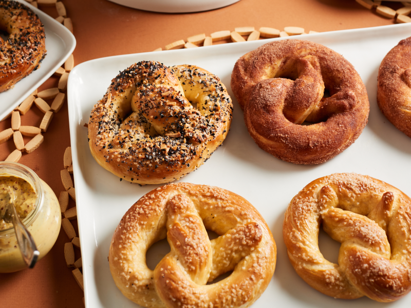 White tray full of cinnamon and sugar, salted and everything soft pretzels