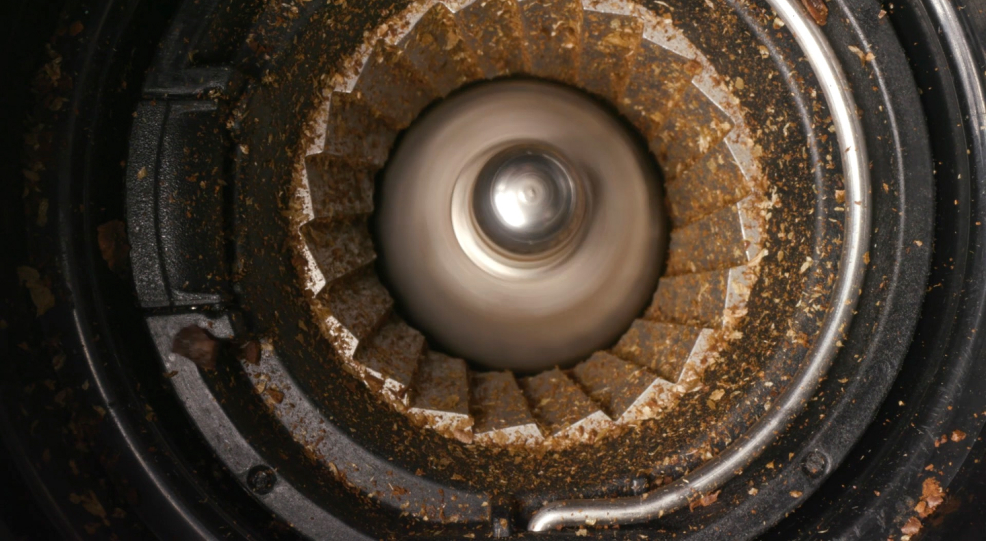 Close-up of coffee in a burr grinder Close-up of coffee in a burr grinder