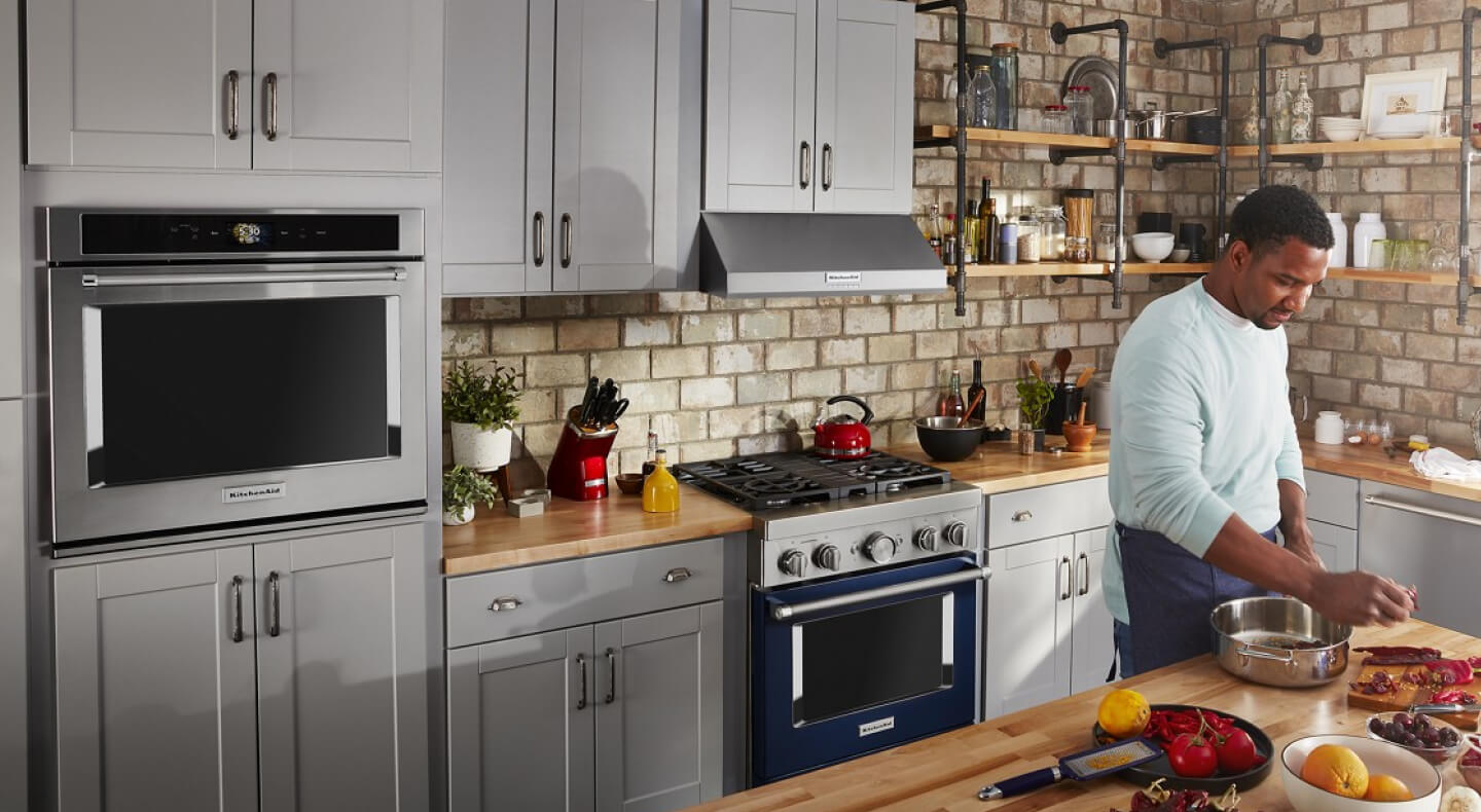 Person cooking in an open concept kitchen