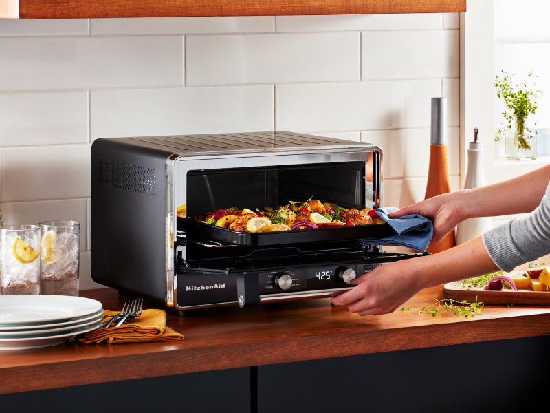A fresh meal cooking in a KitchenAid® toaster oven A fresh meal cooking in a KitchenAid® toaster oven