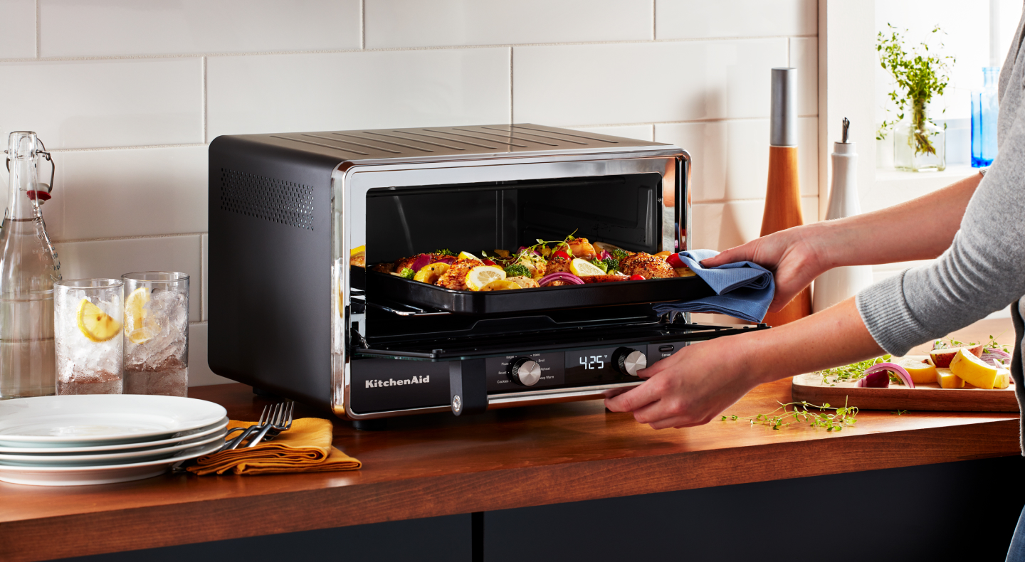A fresh meal cooking in a KitchenAid® toaster oven A fresh meal cooking in a KitchenAid® toaster oven