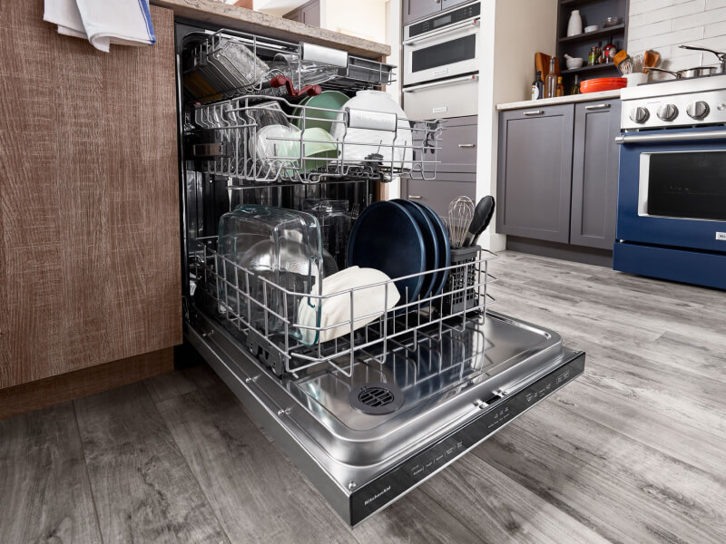 A full open dishwasher A full open dishwasher