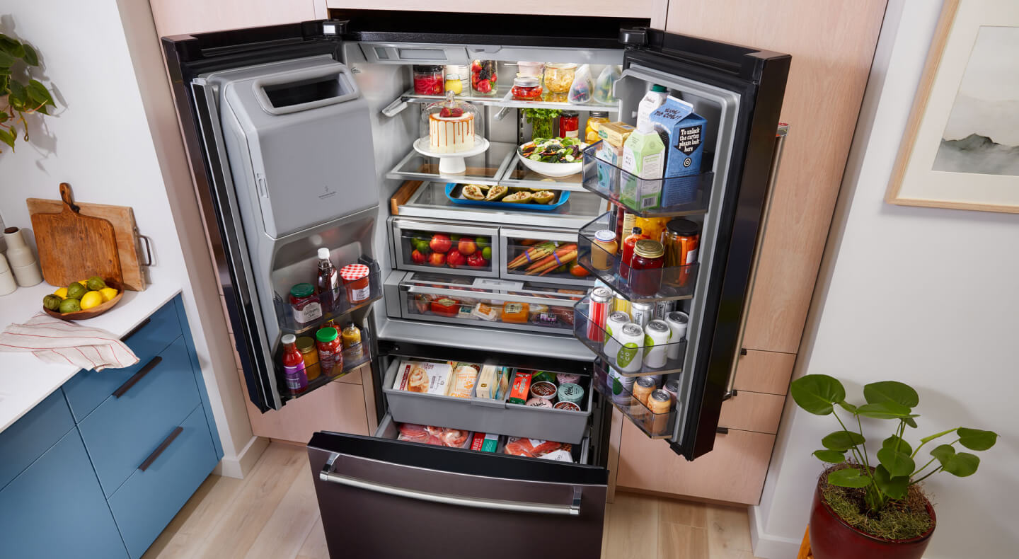View from above bottom freezer refrigerator with all doors open View from above bottom freezer refrigerator with all doors open