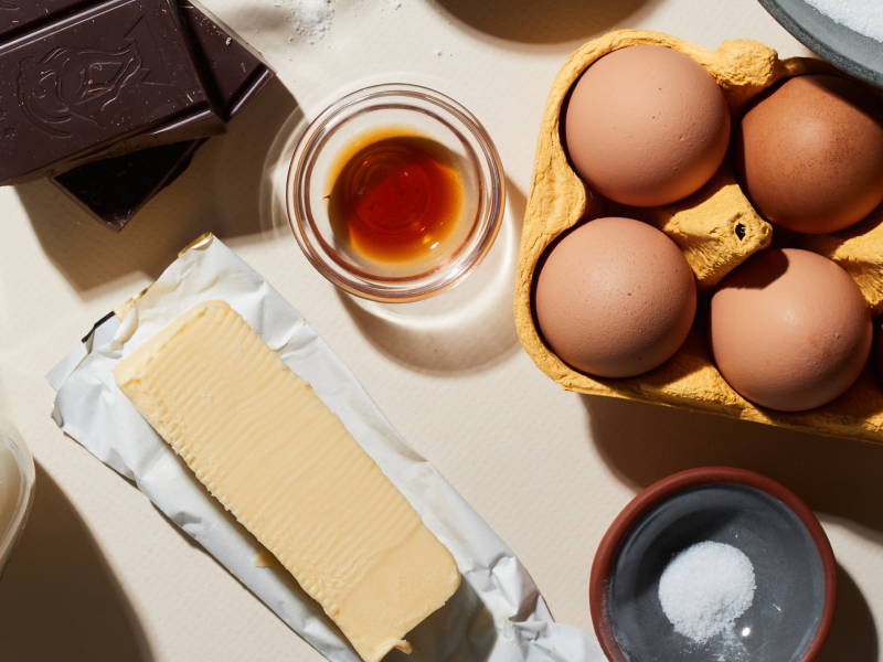Birds-eye view of eggs, butter and other ingredients on counter Birds-eye view of eggs, butter and other ingredients on counter