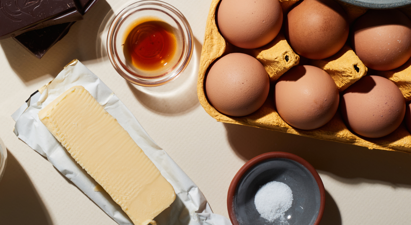 Birds-eye view of eggs, butter and other ingredients on counter Birds-eye view of eggs, butter and other ingredients on counter