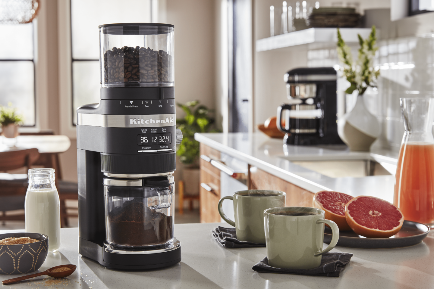 Coffee beans in a black KitchenAid® Burr Coffee Grinder in a modern kitchen Coffee beans in a black KitchenAid® Burr Coffee Grinder in a modern kitchen