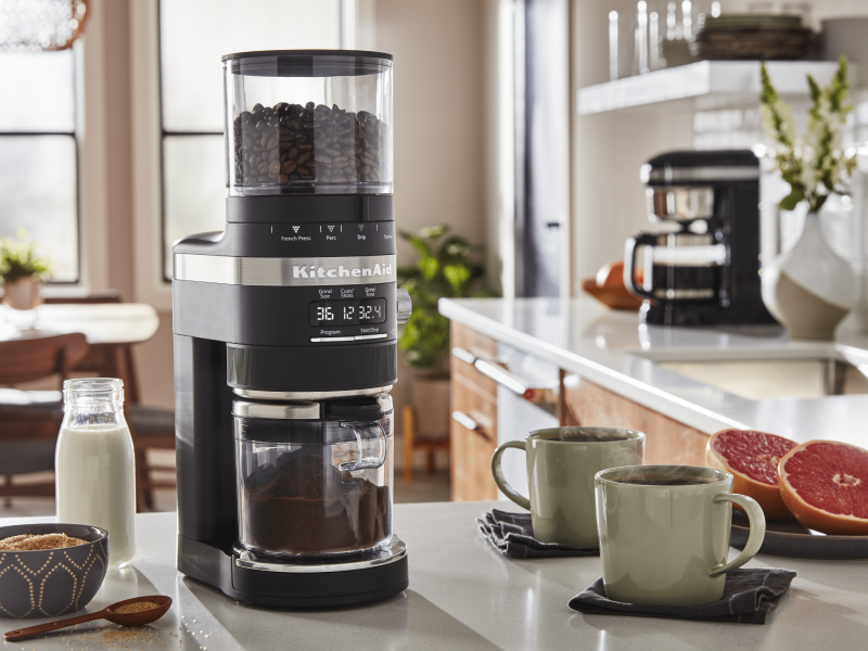 Coffee beans in a black KitchenAid® Burr Coffee Grinder in a modern kitchen Coffee beans in a black KitchenAid® Burr Coffee Grinder in a modern kitchen