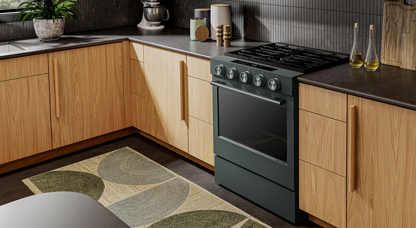 Juniper KitchenAid® gas range in light wood cabinetry
