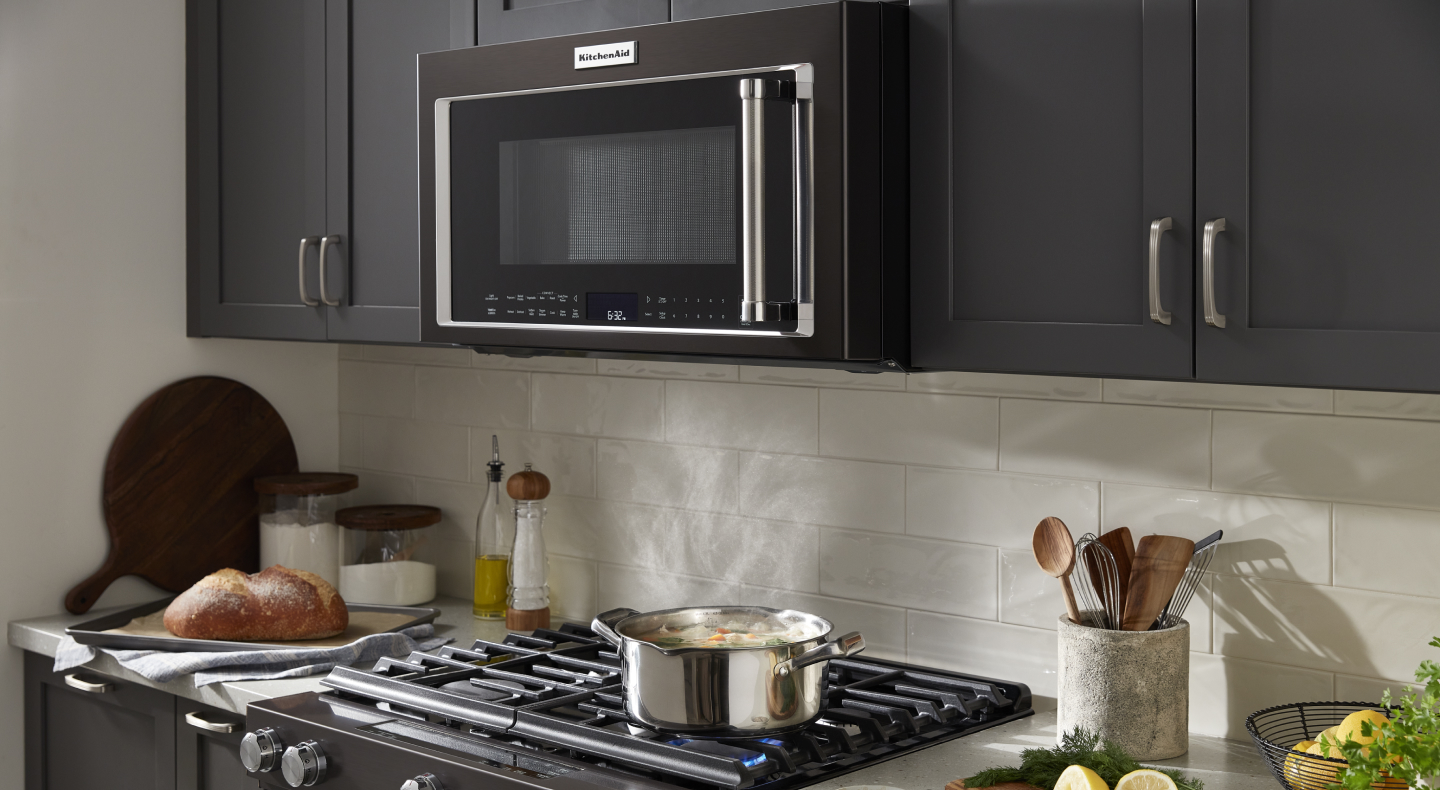 Black microwave hood combination in a black kitchen Black microwave hood combination in a black kitchen
