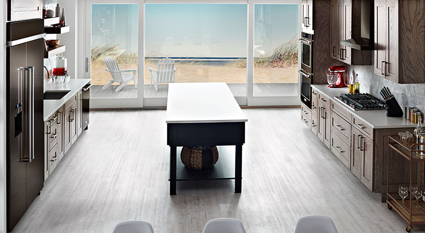 A spacious galley kitchen with an island A spacious galley kitchen with an island