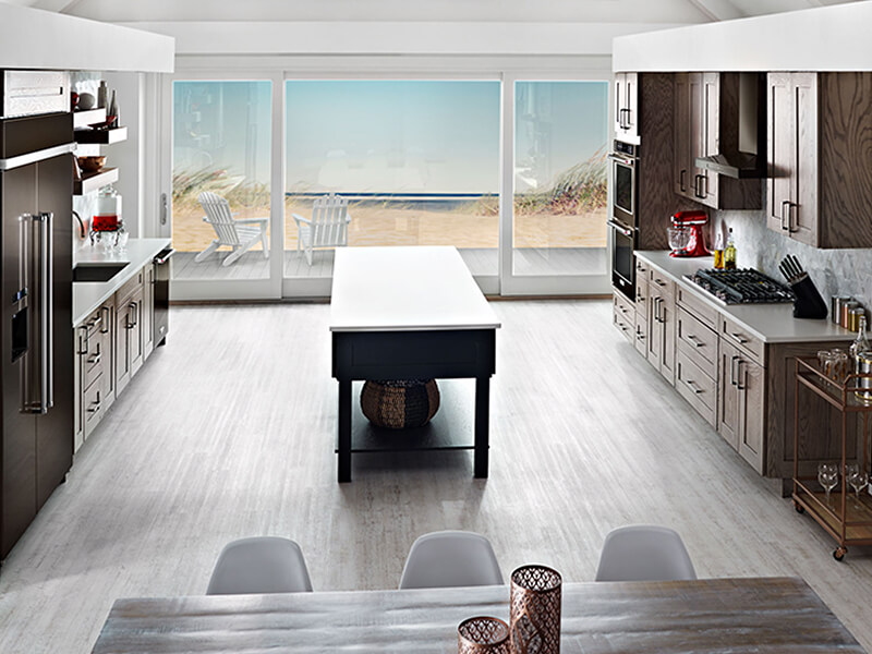 A spacious galley kitchen with an island A spacious galley kitchen with an island