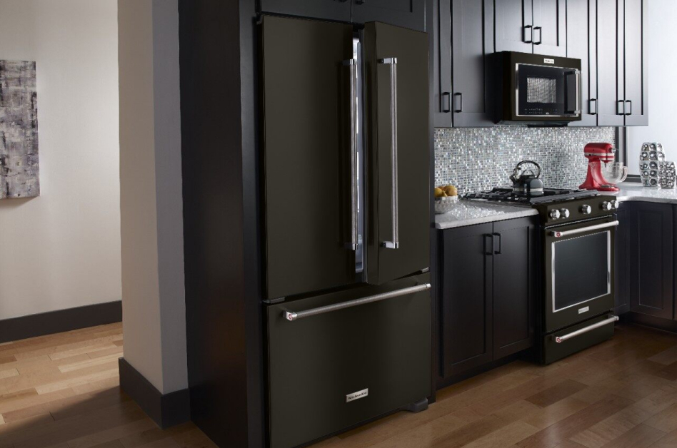 Black stainless steel refrigerator style in dark, modern kitchen Black stainless steel refrigerator style in dark, modern kitchen